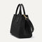 The Classic Handbag in Black shown in diagonal view.
