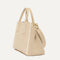 The Classic Handbag in Soft Sesame shown in diagonal view.