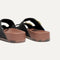 Close up of the heel of The Buckle Slide Sandal in Black.