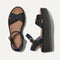 The Criss-Cross Lightweight Wedge Sandal in Black shown from the top.