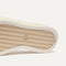 Close up of the outsoles of The Court Sneaker in Sand Dune, with raised grooves for added traction. 