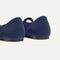 Close up of the heel of The Bow Point II in Deep Navy, with Rothy's signature blue halo.