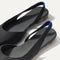 Close up of the strap on The Almond Slingback in Black, with Rothy's signature blue halo.