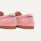 Close up of the heel of The Boat Shoe in Sunbaked Pink, with Rothy's signature blue halo. 