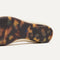 Close up of the outsole of The Emblem Point II in Conch, shown in a diagonal view. 