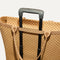The Zip Travel Tote shown attached to a rolling suitcase using the wrap-around band.