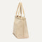 The Zip Travel Tote in Parchment Basketweave shown from the side.