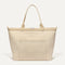 PDP |The Zip Travel Tote in  Parchment Basketweave shown from the front.