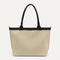 PDP |The Lightweight Zip Tote in Black and White Raffia-Knit shown from the front.