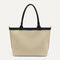PDP |The Lightweight Zip Tote in Black and White Raffia-Knit shown from the front.