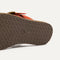 Close up of the outsole of The T-Strap Sandal in Brick.