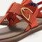 Close up of the T-strap and buckle detail of The T-Strap Sandal in Brick. 