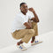 Alternate view of a model wearing The Men's Court Sneaker in Turbo Blue.