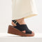 hover | Model wearing The Wedge in Black. 