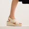 hover | Model wearing The Wedge in White Sand. 