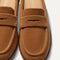 Close up of the toe and vamp of The Penny Loafer Mule in ReVelvet Caramel, showing the penny keeper detail.