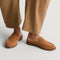 hover | Model wearing The Penny Loafer Mule in ReVelvet Caramel.