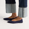 hover | Model wearing The Point III in Navy. 