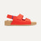 The Kids Double Strap Sandal in Firetruck Red shown from the side.