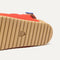 The sole of The Kids Double Strap Sandal in Firetruck Red.