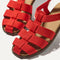 Close up of the straps across the top of The Fisherman Sandal in Scarlet. 
