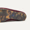 Close up of the outsoles of The Double Bit Loafer Mule in ReVelvet™ Syrah. 