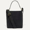 PDP |The Bucket Bag in ReVelvet™ Black shown from the front.