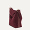 hover | The Bucket Bag in ReVelvet™ Syrah in a diagonal view.