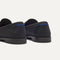 Close up of the heel of The Penny Loafer in Black, with Rothy's signature blue halo. 