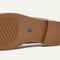 The sole of The Penny Loafer in Cinnamon Raffia-Knit. 