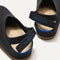 Close up of the back heel strap of The Kids Clog in Original Black. 