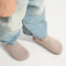 hover | A child wearing The Kids Clog in Original Dove. 