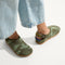 hover | A child wearing The Kids Clog in Green Camo. 