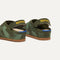 Close up of the heel of The Kids Clog in Green Camo, with Rothy's signature blue halo. 