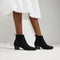 hover | Model wearing The Western Bootie in Black.