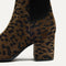 Close up of the block heel of The High Classic Boot in ReVelvet™ Cheetah.