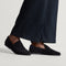 hover | Model wearing The Ravello Penny Loafer in Revelvet Black. 