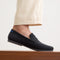 hover | Model wearing The Ravello Penny Loafer in Black. 
