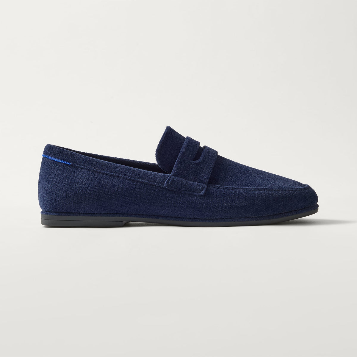 side | The Ravello Penny Loafer in Deep Navy shown from the side. 
