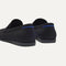 Close up of the heel of The Ravello Penny Loafer in Black, with Rothy's signature blue halo on the pull tab.