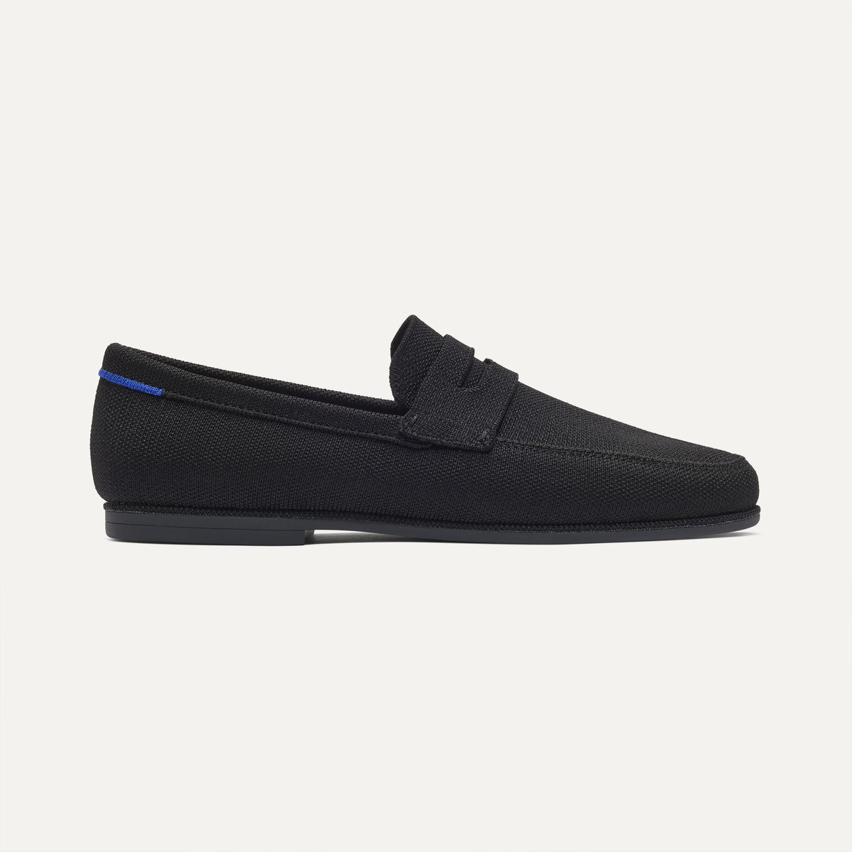 side | The Ravello Penny Loafer in Black shown from the side. 