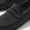 Close up of the vamp and penny keeper detail on The Ravello Penny Loafer in Black.