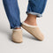 hover | Model wearing The Après Clog in ReVelvet Cream Herringbone.