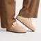 hover | Model wearing The Teddy Buckle Clog in Honey.