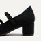 Closeup of the heel on The Double Buckle Mary Jane Heel in ReVelvet™ Black.