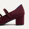 Close up of the heel on The Double Buckle Mary Jane Heel in ReVelvet™ Syrah.