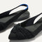 Close up of the toe and twist detail on The Twist Point Slingback in Black.