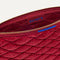 The ReVelvet™ Convertible Clutch in ReVelvet™ Ruby Quilt shown open from the top in diagonal view.