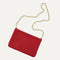 Overlay:: Shown with The Crossbody Strap (sold separately). | Alt:: An image of The Convertible Clutch in Scarlet Open Knit paired with The Crossbody Strap.