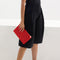 hover | Model shown holding the Convertible Clutch in Scarlet Open-Knit.
